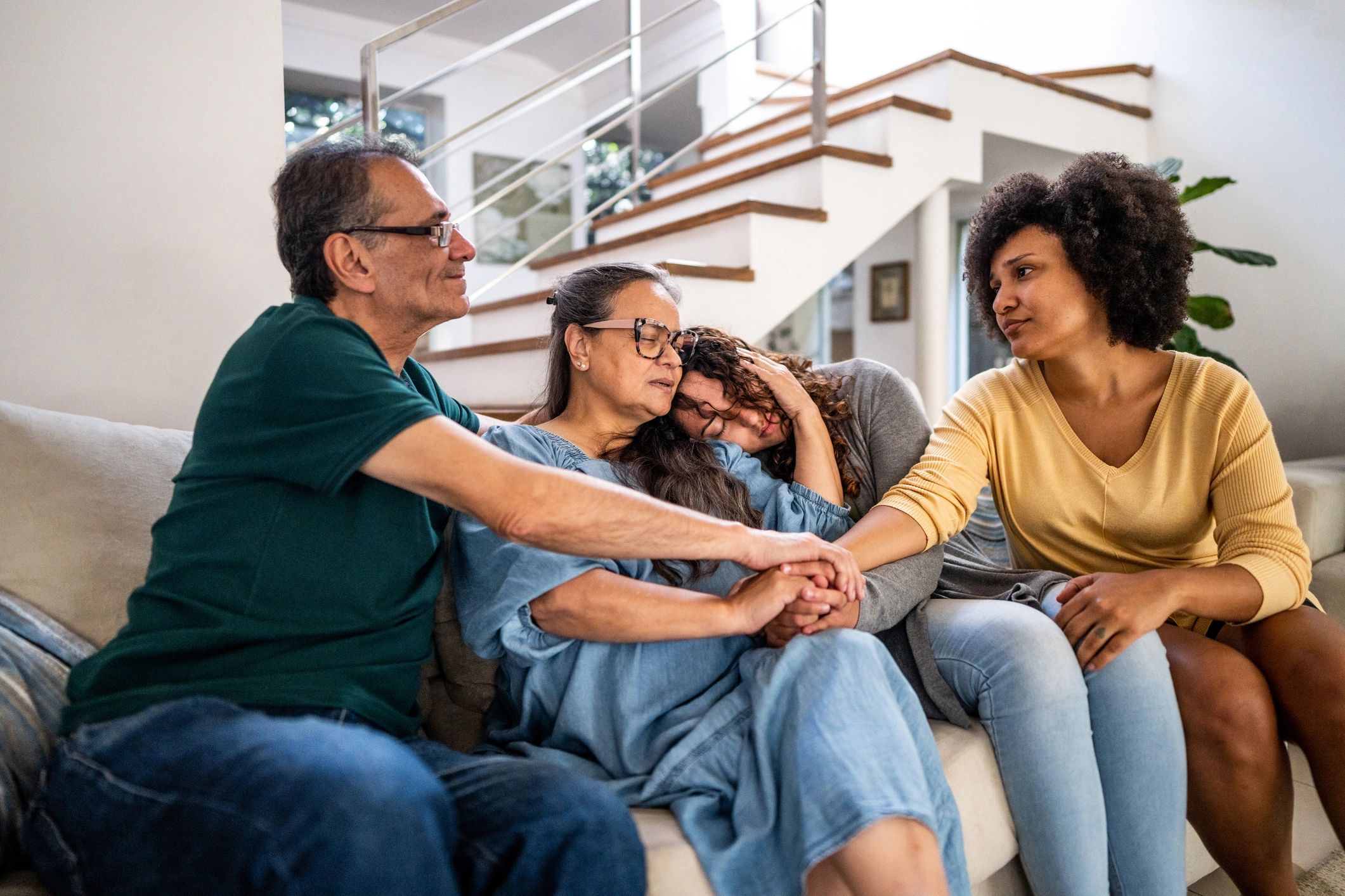 Family members supporting one another at home