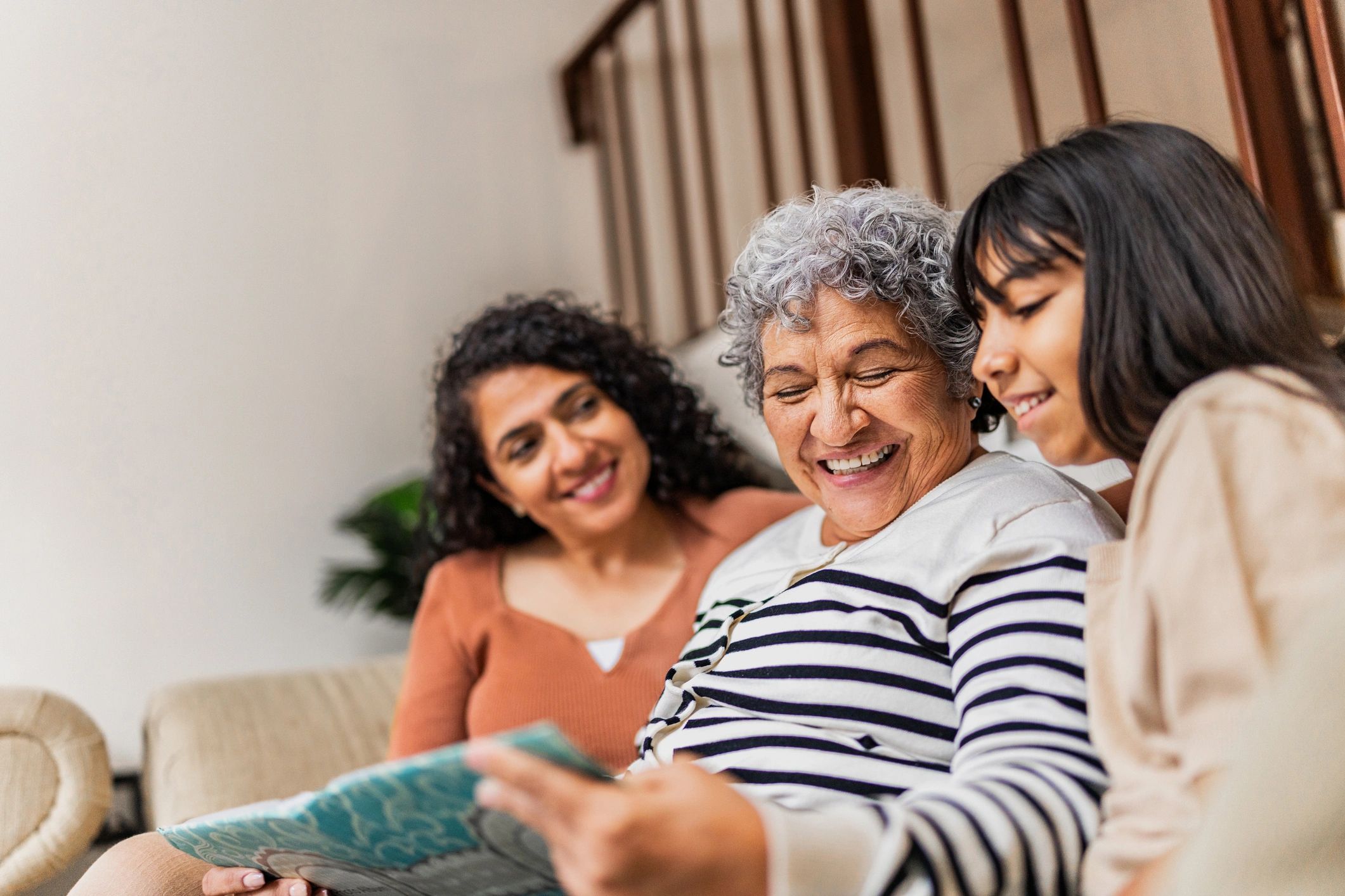 Family together at home reviewing memories
