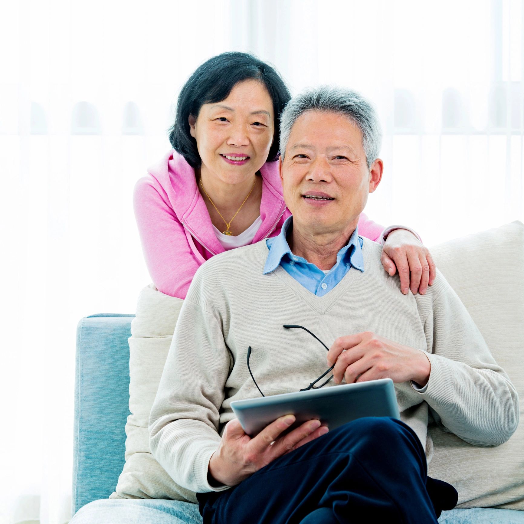 Older couple at home reviewing care information together